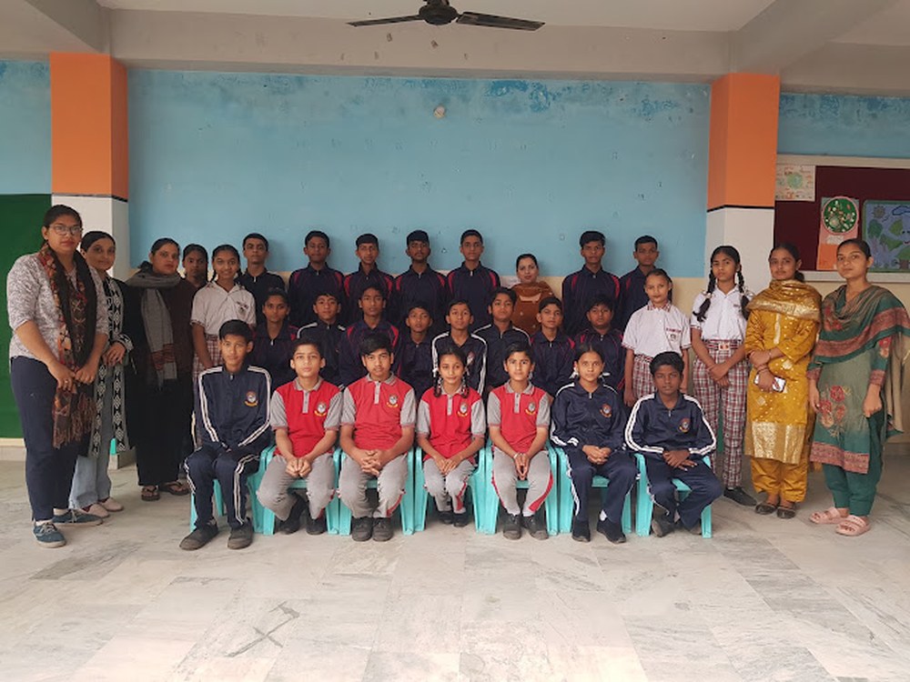 The whole school, students and staff, gathered for a group photo